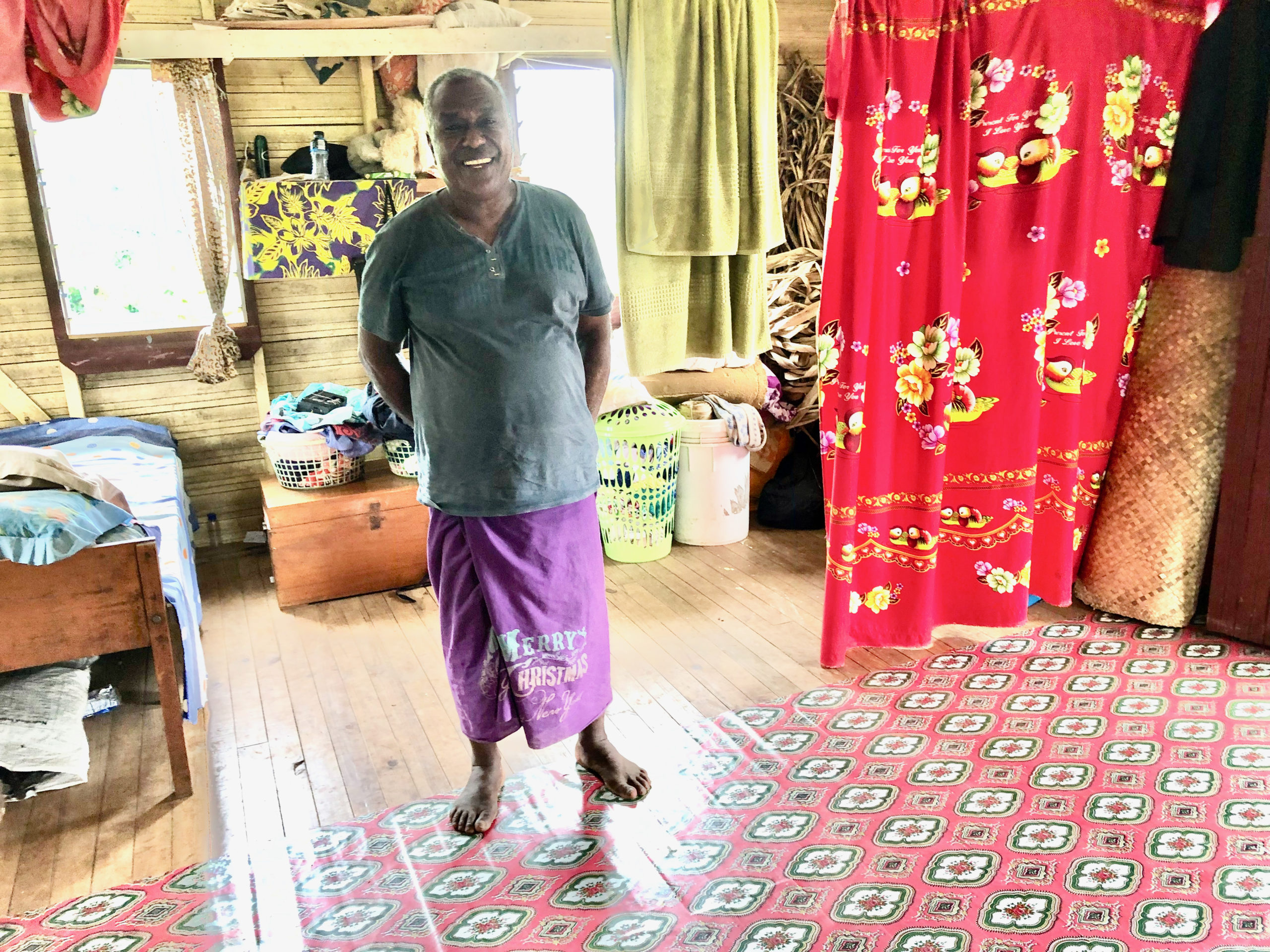 Simione_Botu_inside_his_third_house_in_New_Vunidogoloa_Fiji